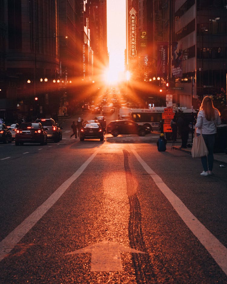 Busy City Street During Sunset
