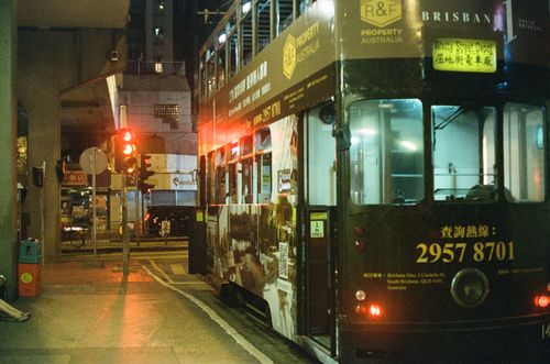 Free A bustling night scene featuring a tram on a city street, highlighting urban public transportation. Stock Photo
