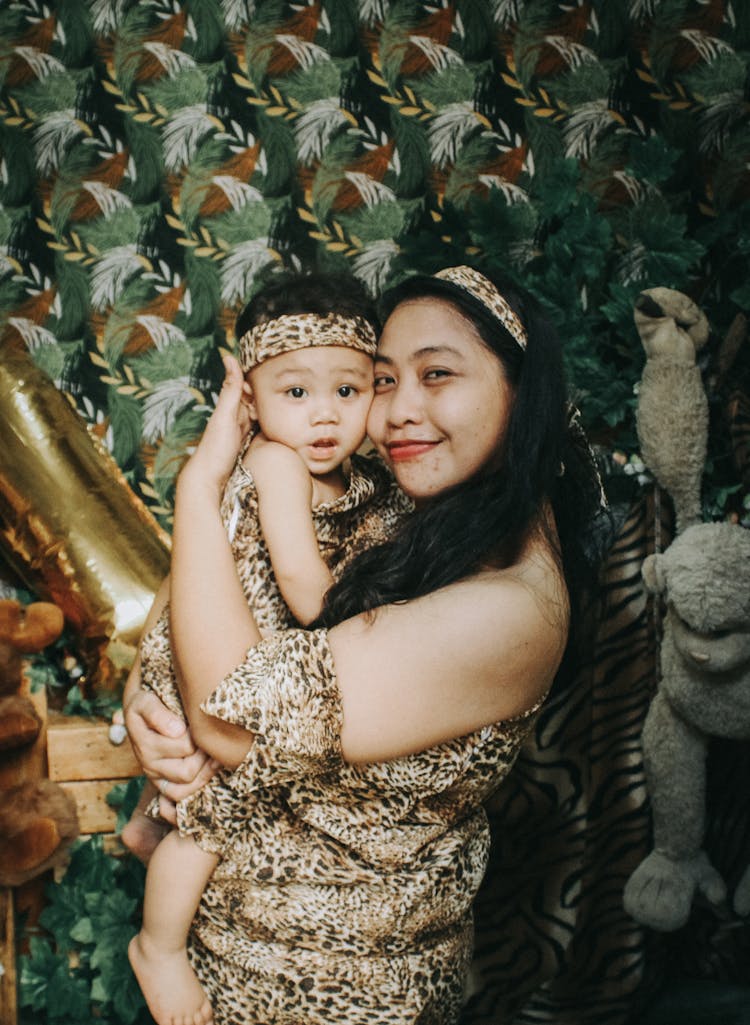 Happy Woman And Child In Animal Costumes