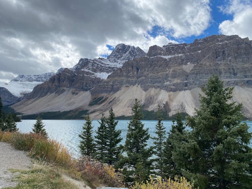 Snowy Mountains Under Clouds in the Sky