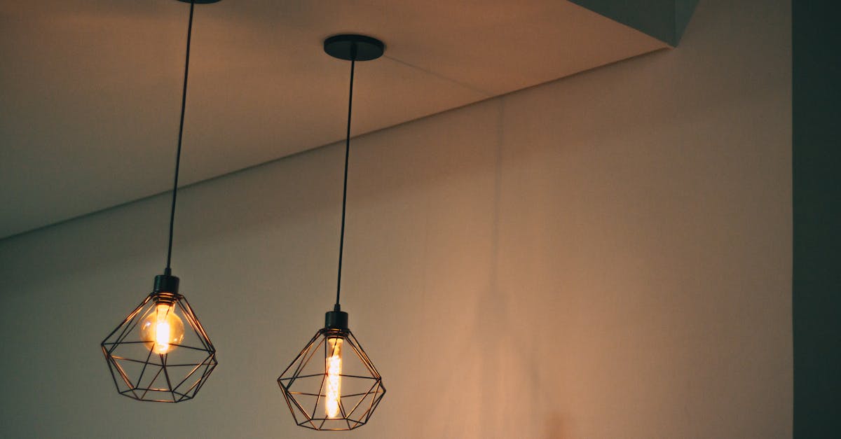 Two Black Pendant Lamp on White Concrete Ceiling
