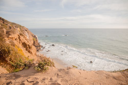 Foto profissional grátis de água, areia, beira-mar