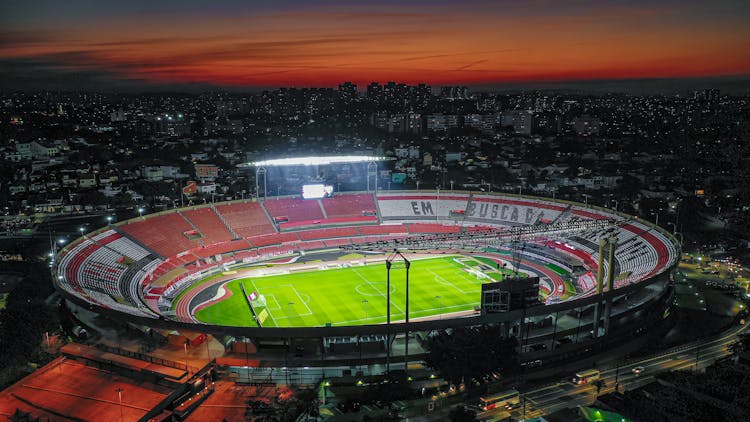 Illuminated Stadium At Sunset