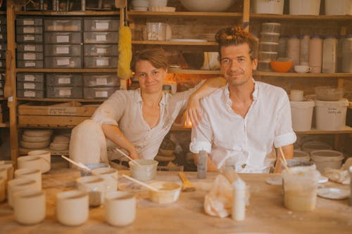 Happy Artist Couple in a Workshop