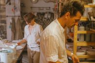 Man in White Dress Shirt and White Pants