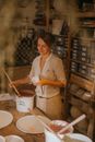 Woman in White and Black Checkered Button Up Shirt Holding White Plastic Bucket