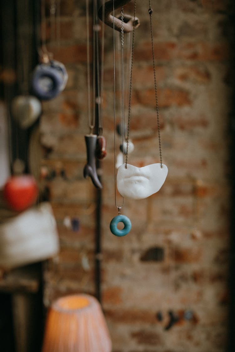 Necklaces Hanging In Close-up Photography