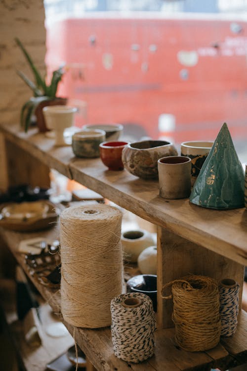  Ceramic Bowls and Ropes on Brown Wooden Shelf