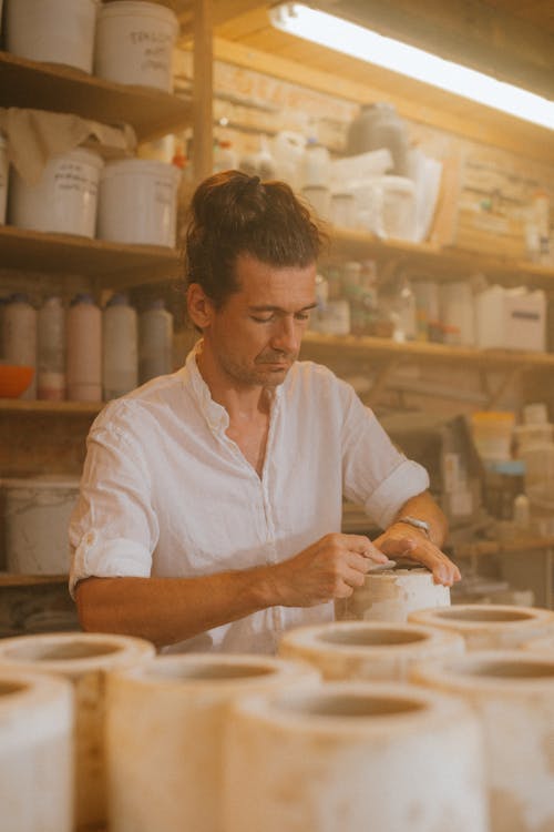 Craftsman working on an Earthenware Pot