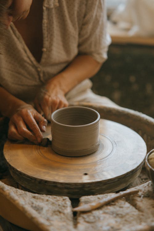 Craftsman molding a Clay Pot
