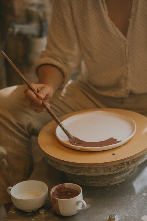 Craftsman doing Finishing Touches at his Clay Work