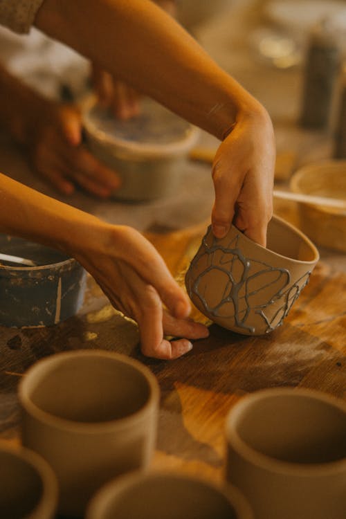 Craftsman doing Finishing Touches at Clay Pots