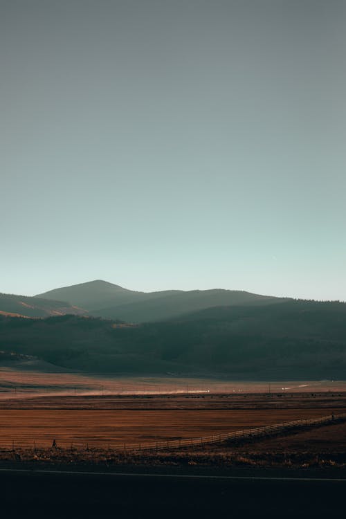 Green Mountains Under Clear Blue Sky