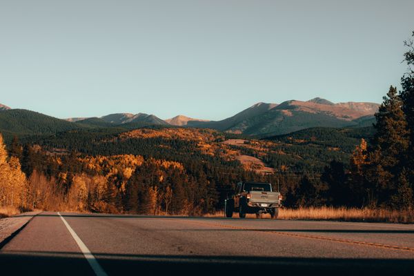 Four-wheel-drive truck on a mountain road in autumn — photo by Jakob Rosen on Pexels
