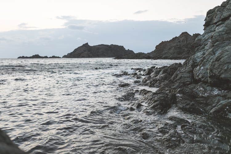 Volcanic Rocks On Sea Shore