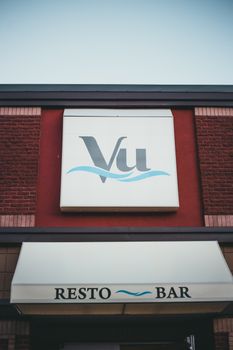 Close-up of the Vu Resto Bar exterior, showcasing the logo under a clear sky. 9738253