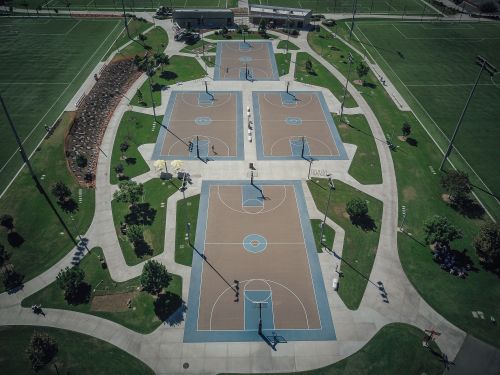 Aerial view of outdoor basketball courts in a park — photo by Kindel Media on Pexels