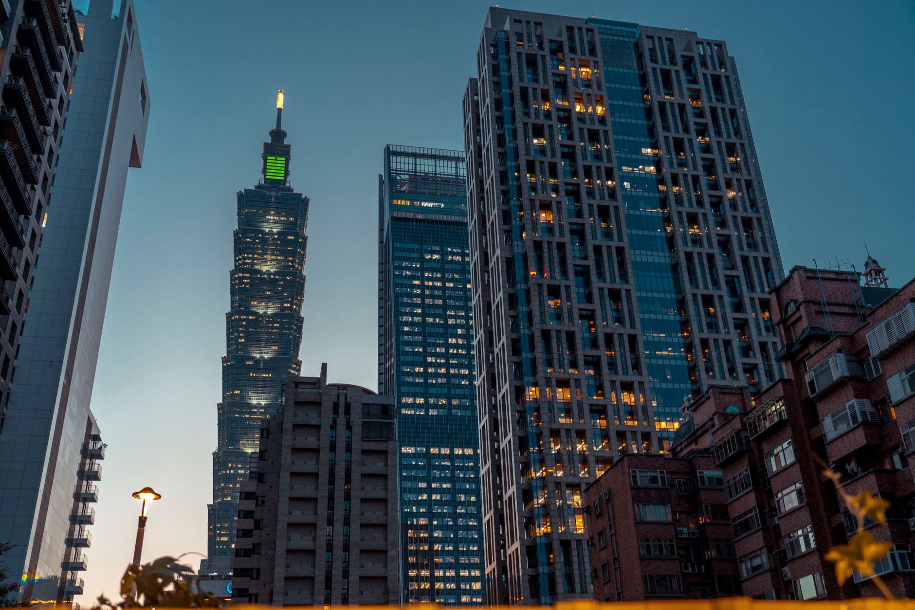 Night view of Taipei skyline featuring iconic tower and modern skyscrapers in cityscape setting