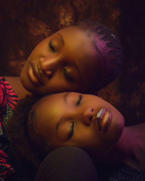 Free Artistic and serene portrait of two African American women with eyes closed, conveying beauty and tranquility. Stock Photo