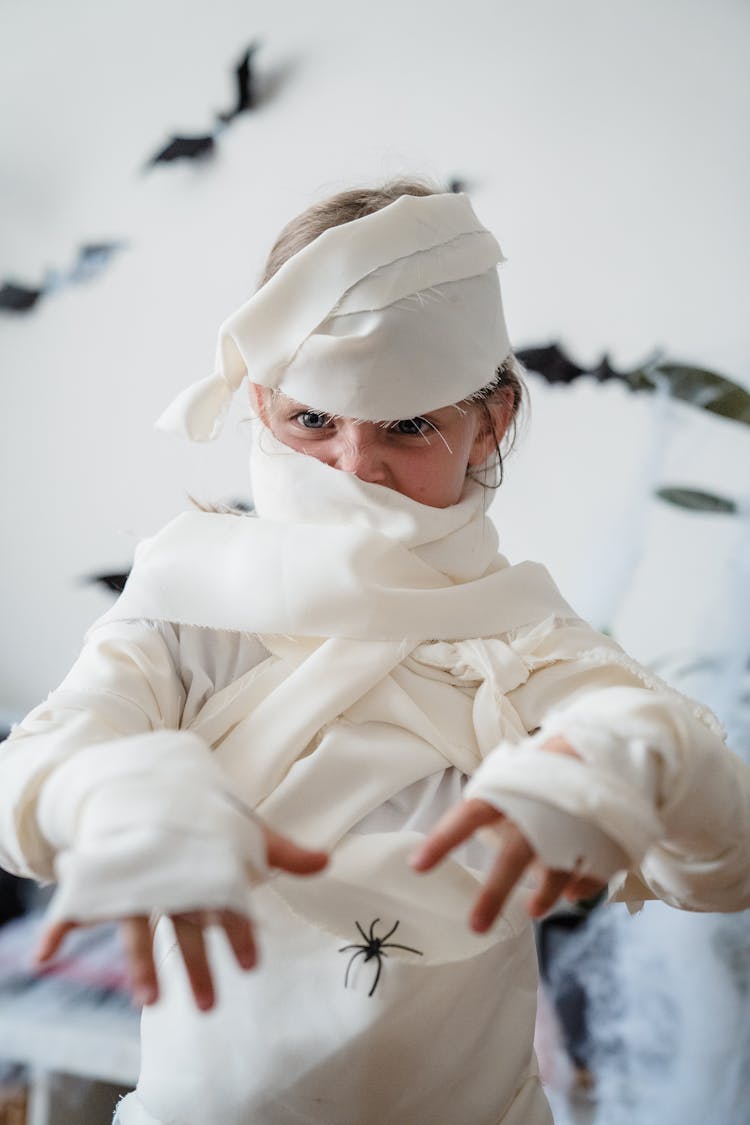 Young Girl Dressed As Mummy For Halloween