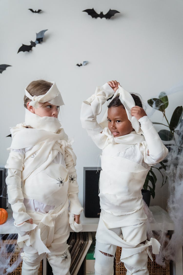 Standing Girls In Mummy Costumes