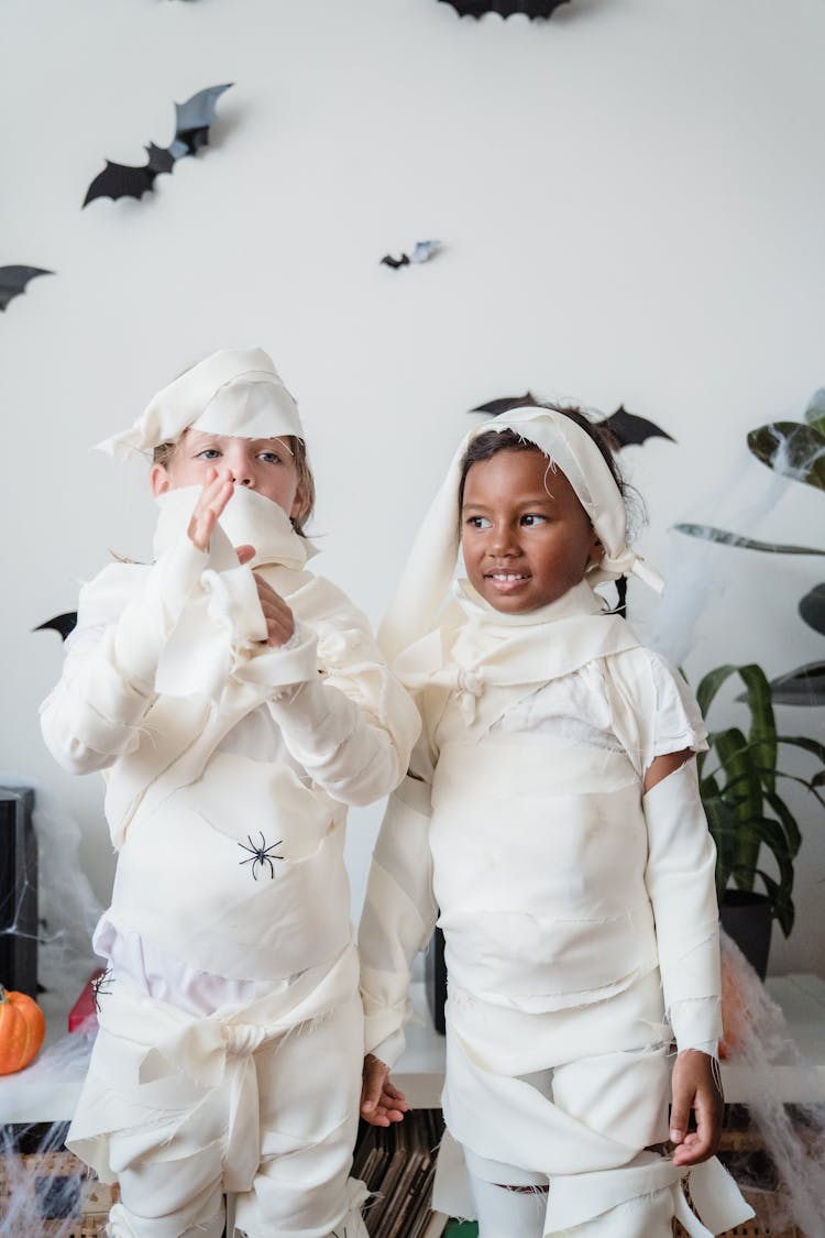 Standing Girls In Mummy Costumes