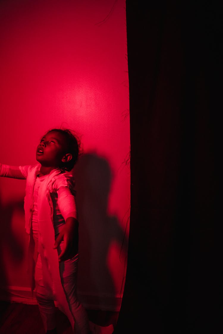 Black Child Dressed Up As Mummy Walking