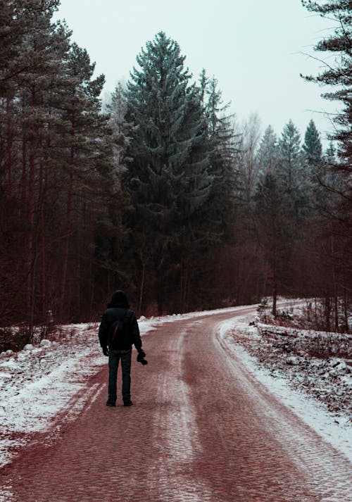 Man standing in the middle of the road 