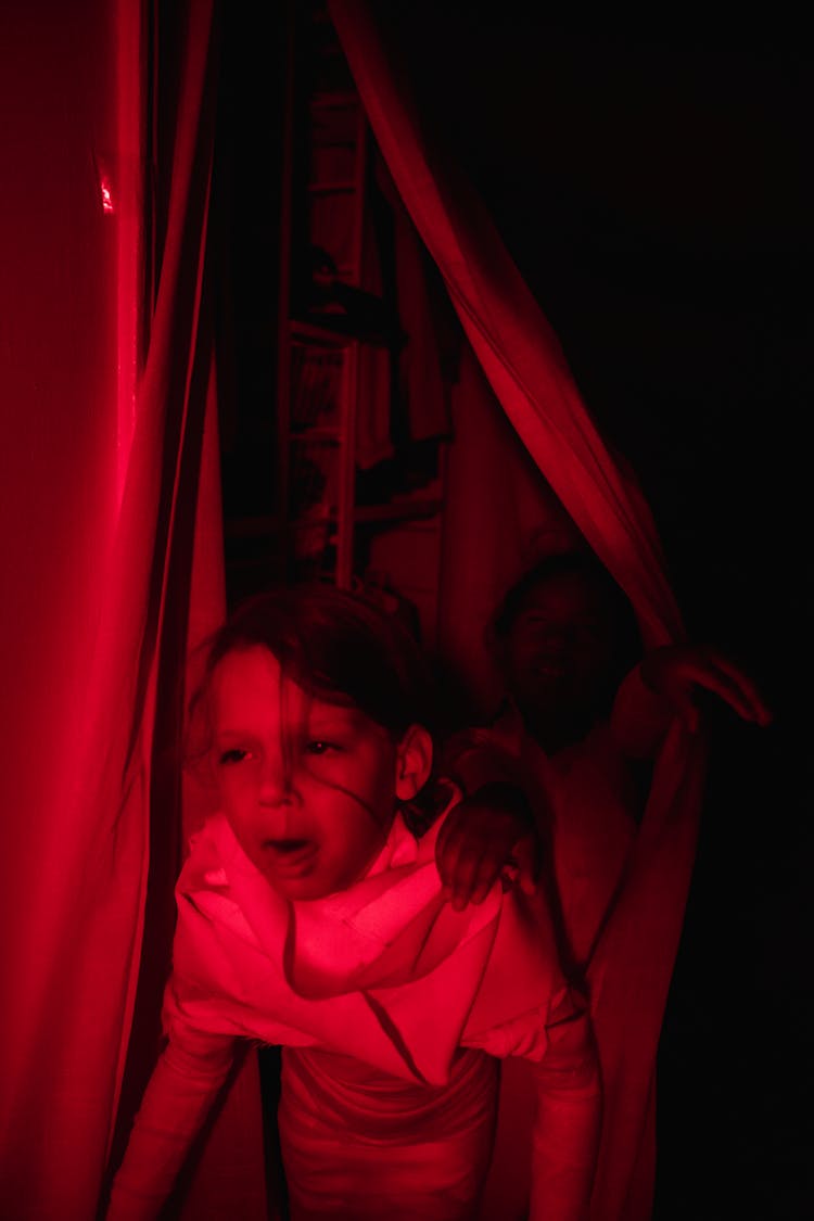 Girl Coming Out From Hide Behind Curtains Screaming Of Fear