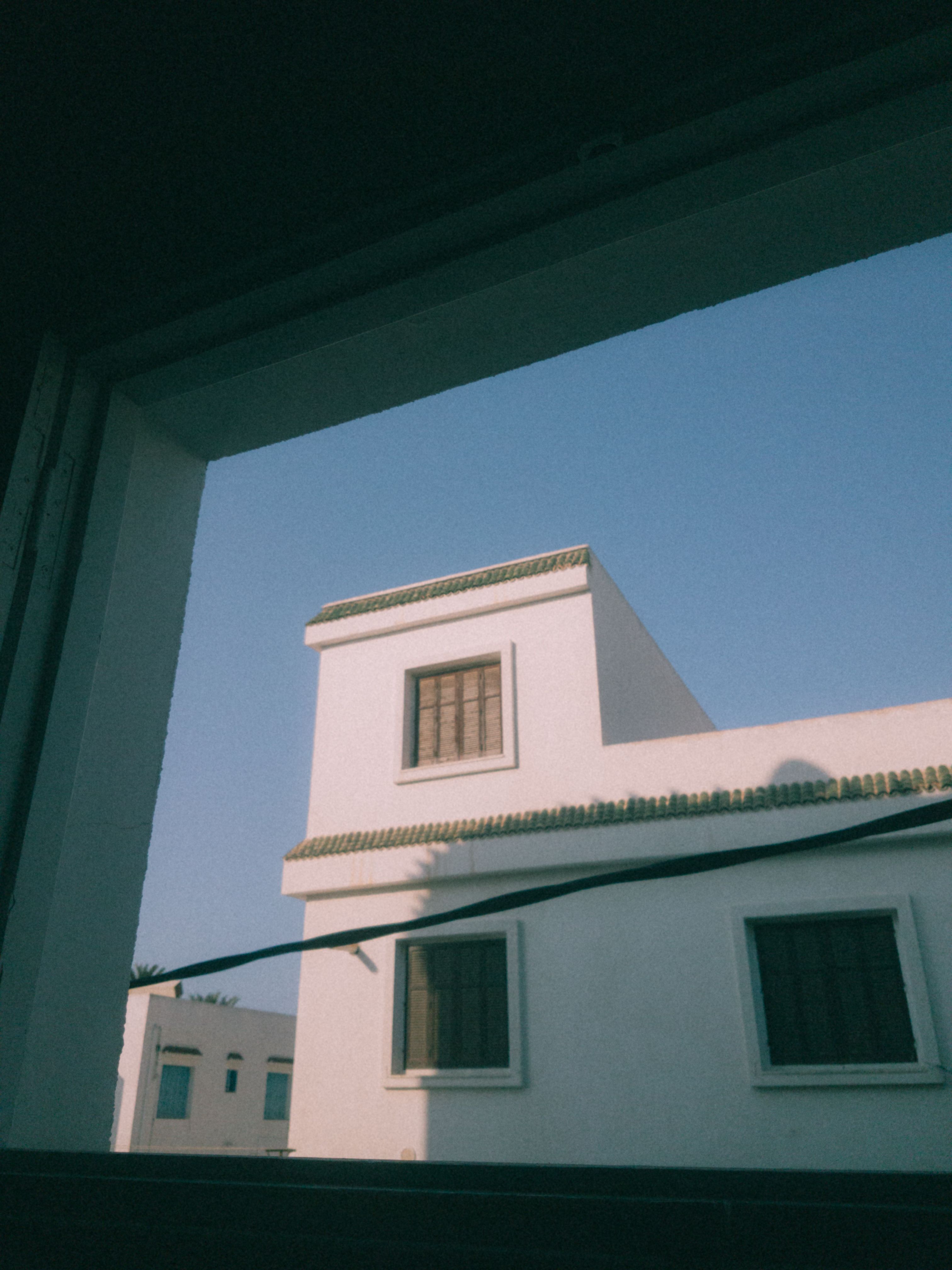 White Concrete House Under Blue Sky · Free Stock Photo