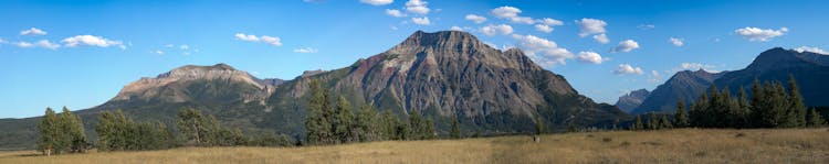 Brown Mountain Under Blue And White Sky