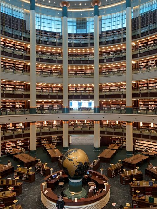Free Explore this large, beautifully designed public library with a central globe display. Stock Photo
