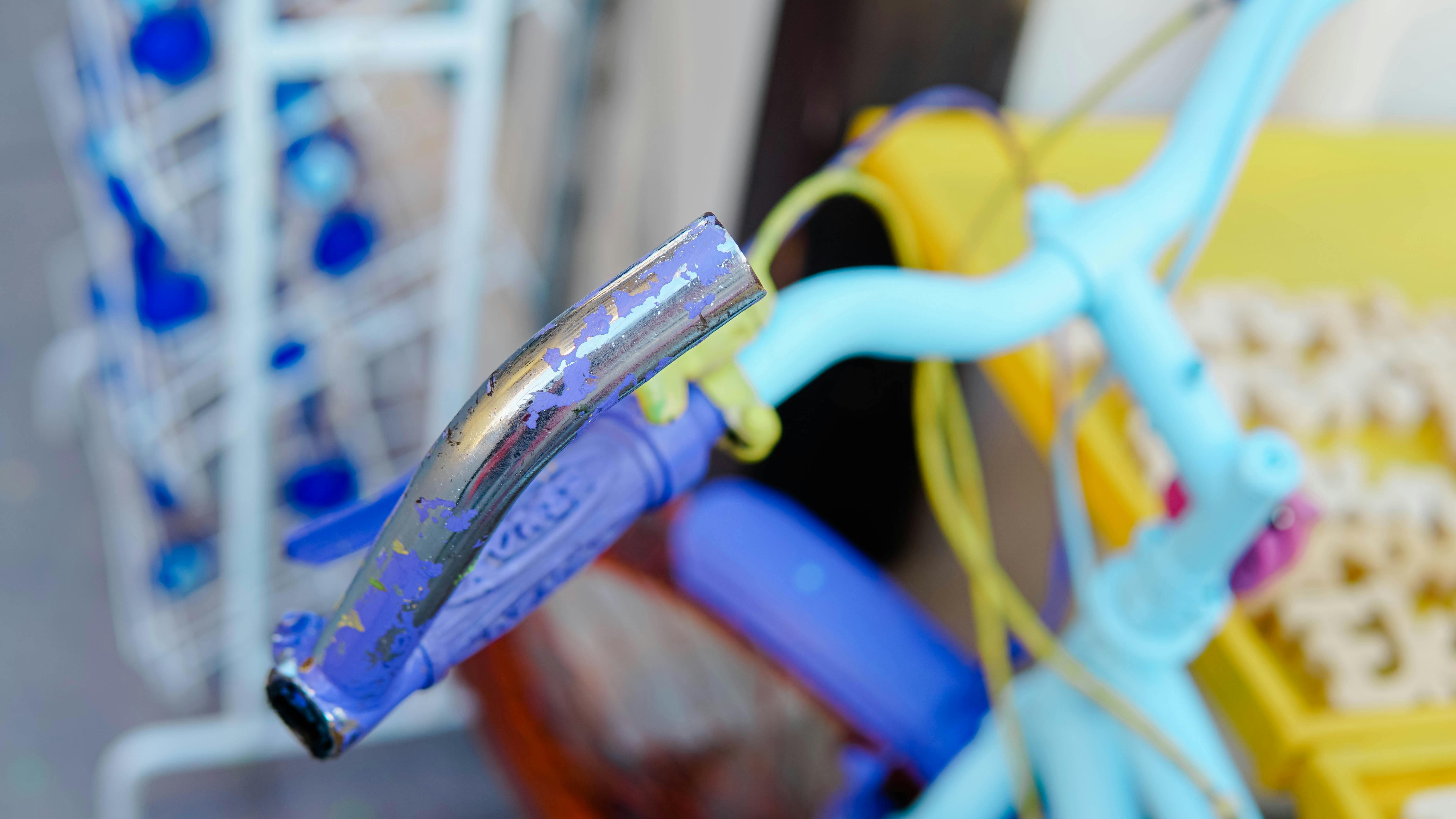 Free Close-up of a colorful vintage bicycle handlebar and grips, focused view. Stock Photo