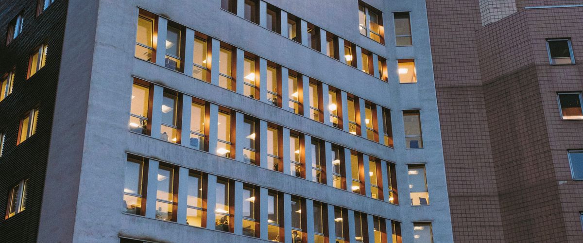 Modern hospital building exterior at dusk