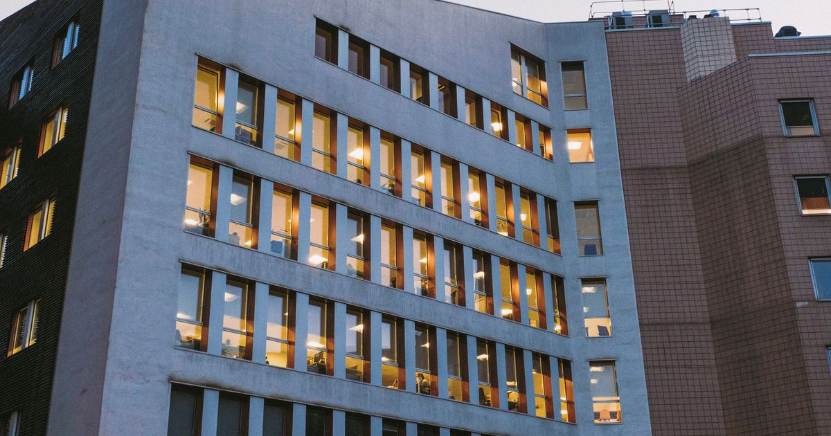 Contemporary hospital building exterior at dusk