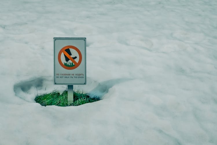 A Metal Signage On A Snow Covered Ground