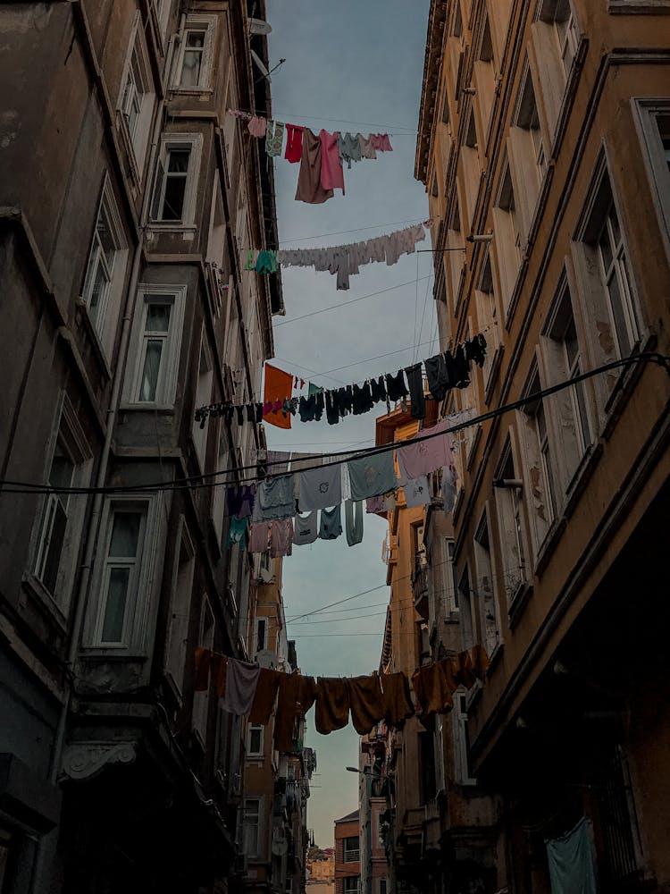 Laundry Hanging On Clothes Line On Buildings