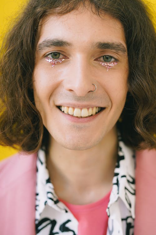 Portrait of smiling man with make-up