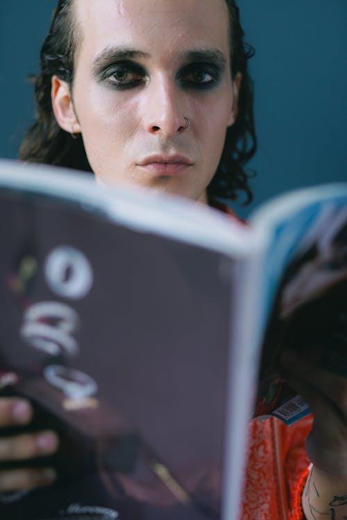 Portrait of man reading magazine