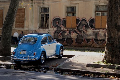 Free A Blue Volkswagen Beetle Parked by the Road Stock Photo