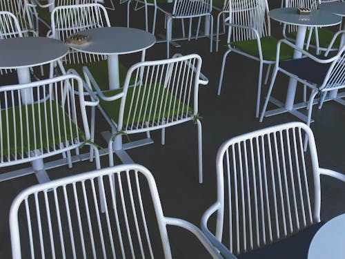 White Metal Framed Green Padded Chairs