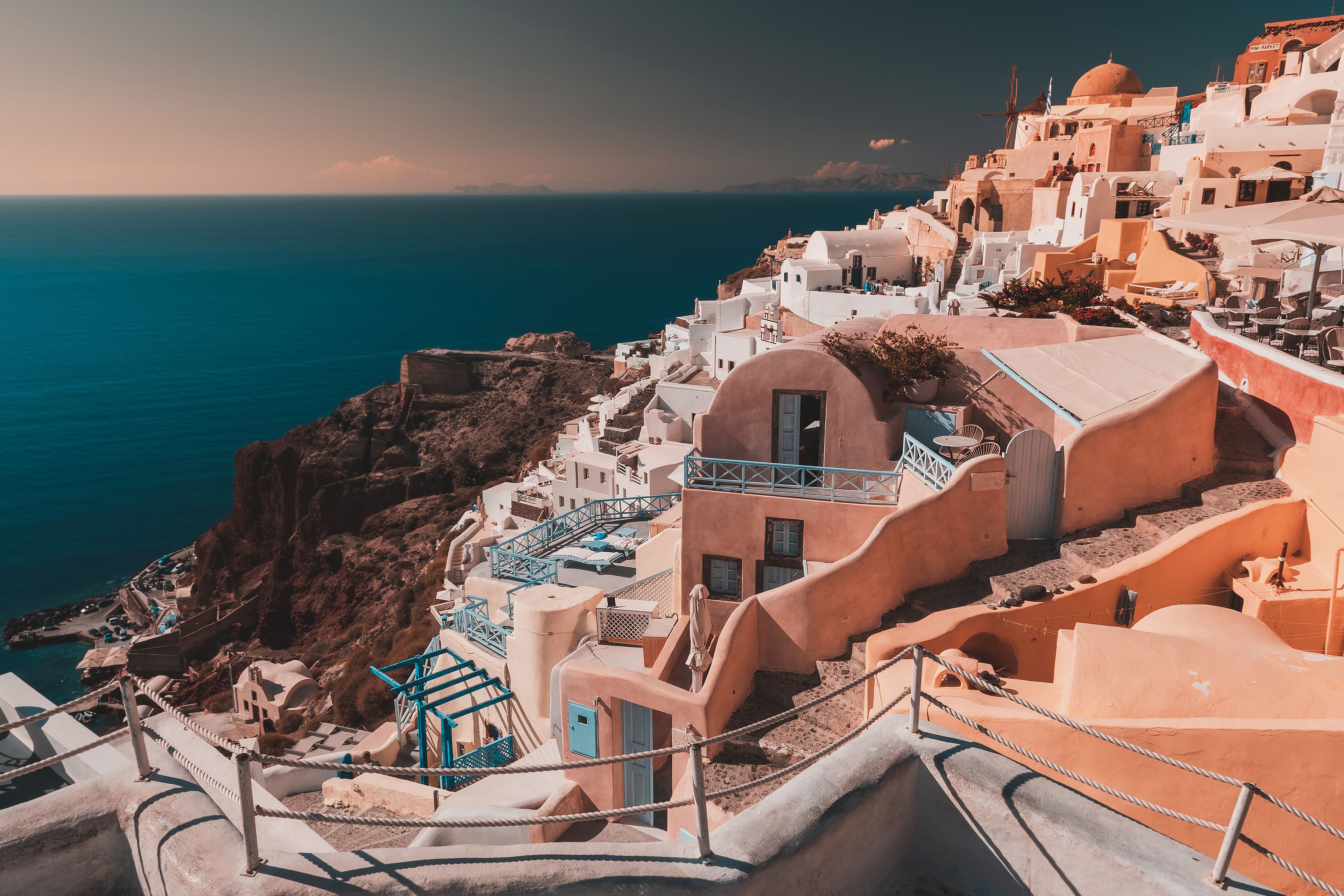 Private caldera-view plunge pool at a honeymoon suite in Imerovigli, Santorini at sunset