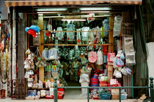 A vibrant market stall in Macau selling various goods and souvenirs.