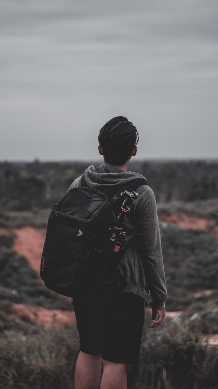 Photo Of A Man Wearing Black Backpack