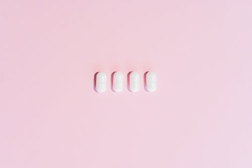 Pills on a Pink Surface