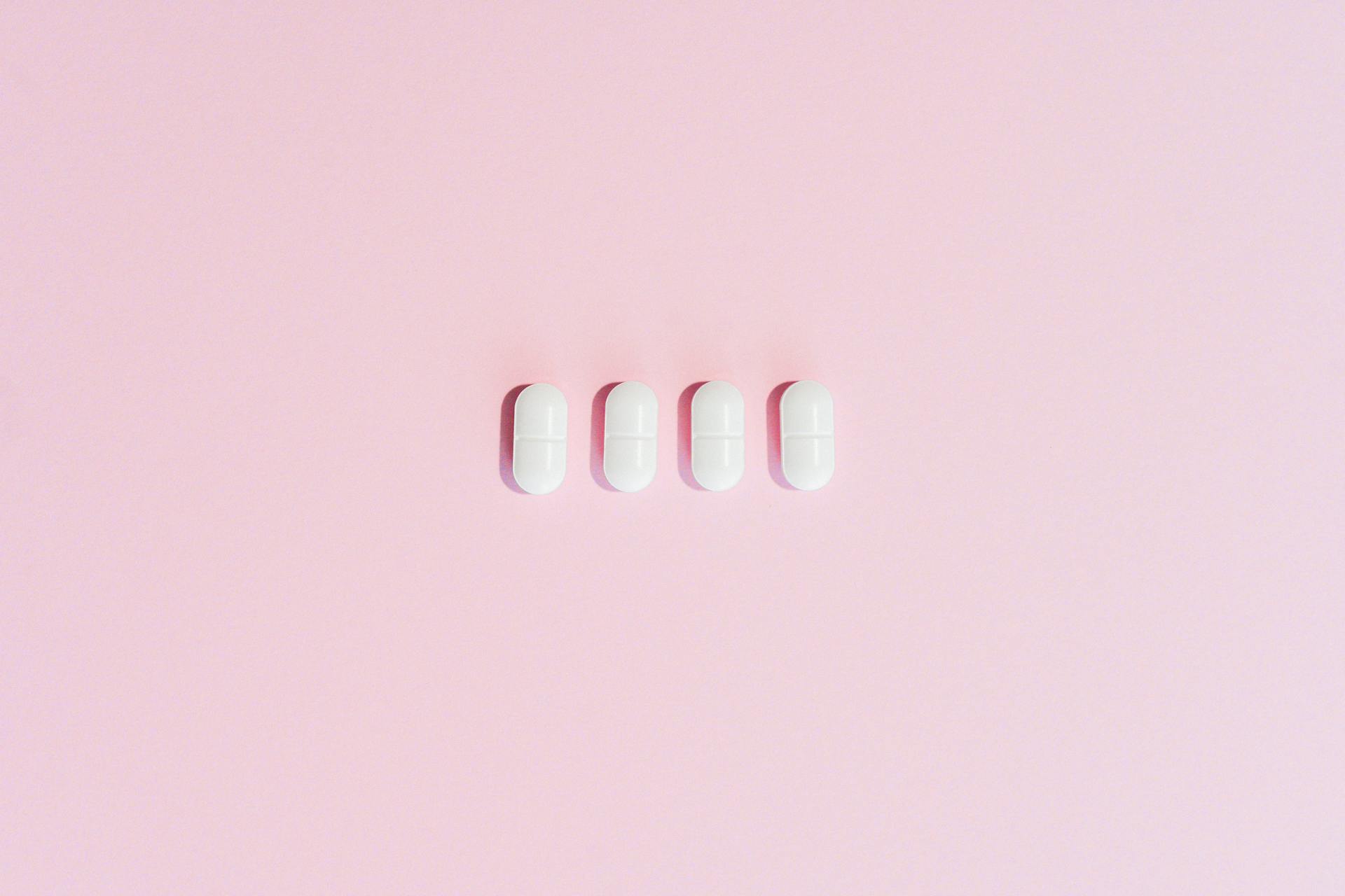 Pills on a Pink Surface