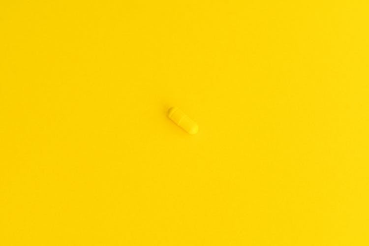 Top View Of A Yellow Capsule