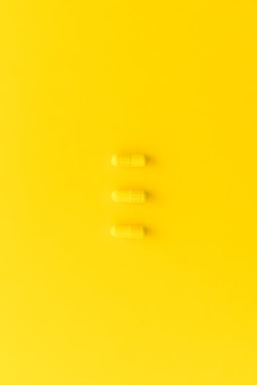 Foto stok gratis kuning, obat, permukaan kuning