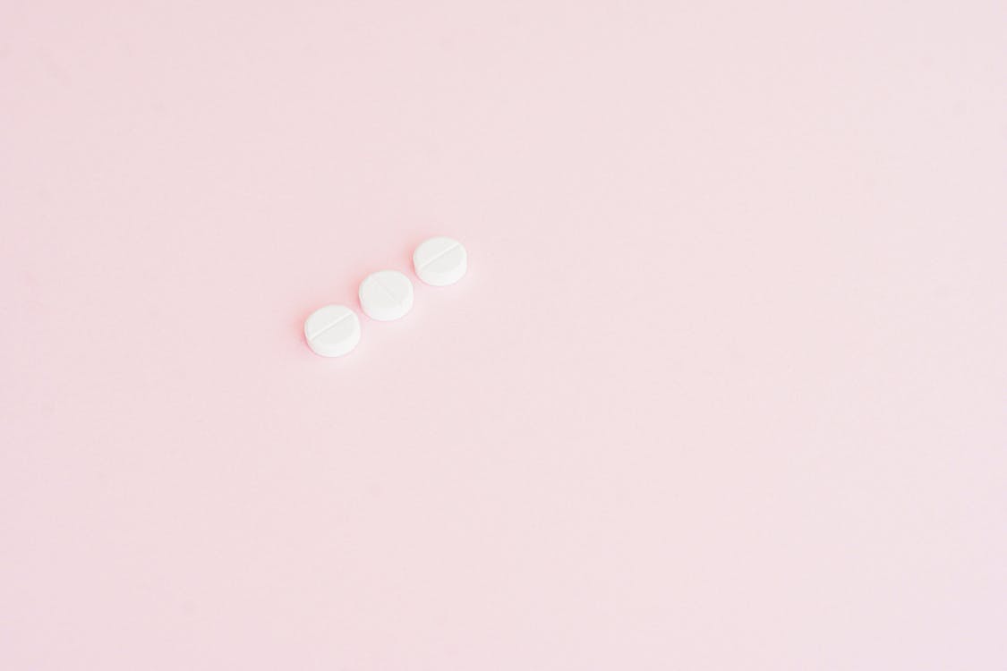 Pills on Pink Surface