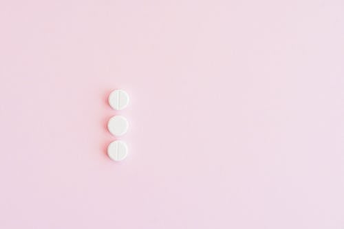 Pills on a Pink Surface